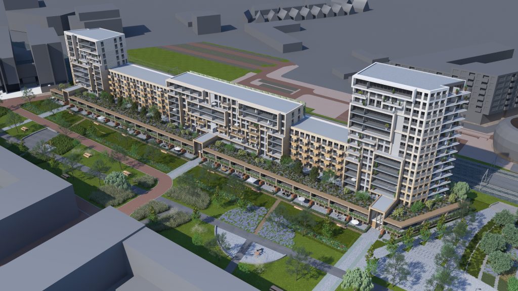 Luchtfoto van modern appartementengebouw met groene omgeving.