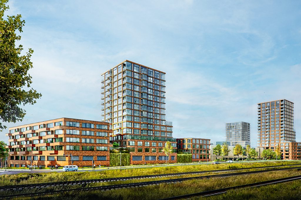 Stedelijke hoogbouw appartementen onder blauwe lucht.